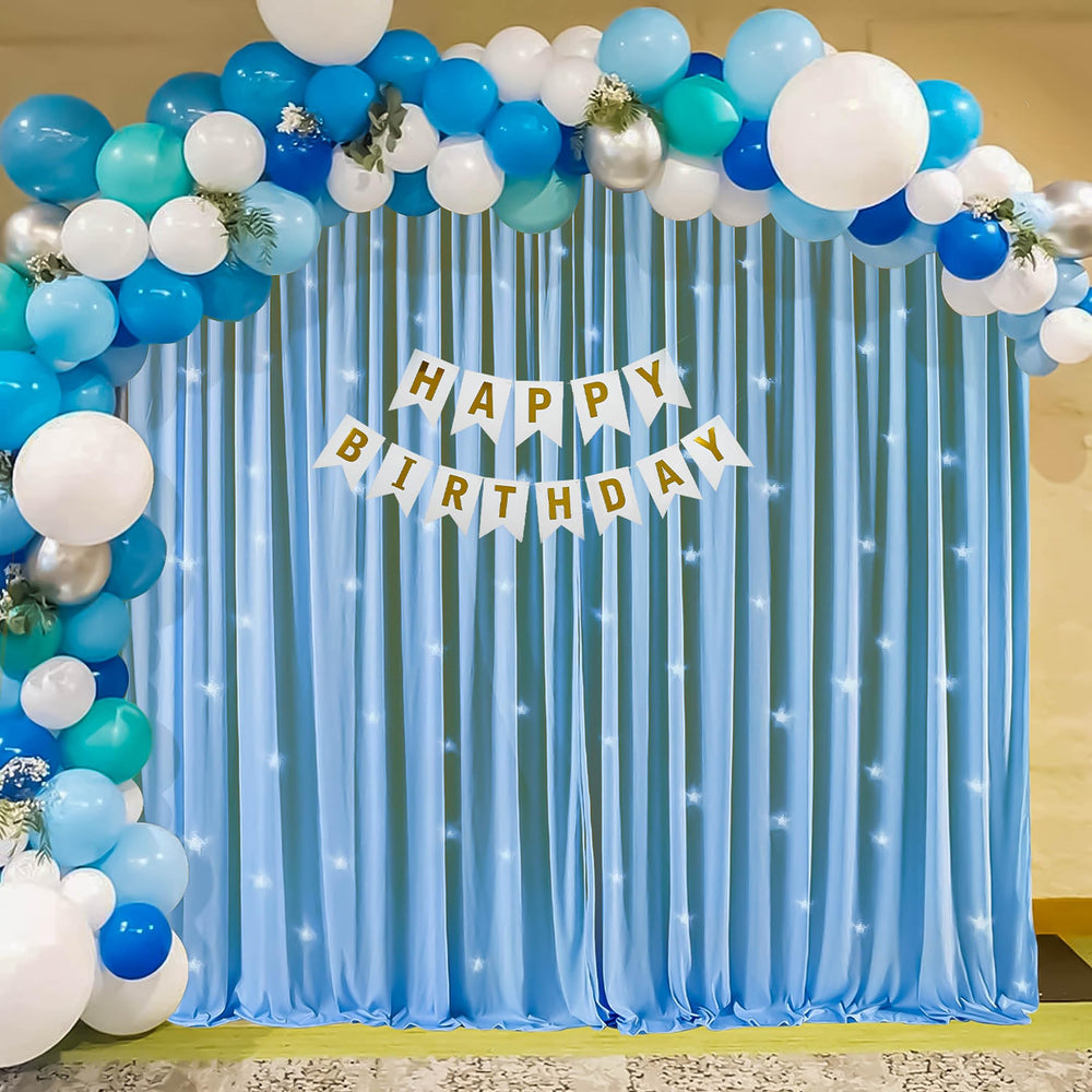 Blue and White Happy Birthday Decoration Theme Setup With Fairy Lights and Net Curtains