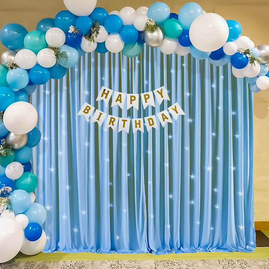 Blue and White Happy Birthday Decoration Theme Setup With Fairy Lights and Net Curtains